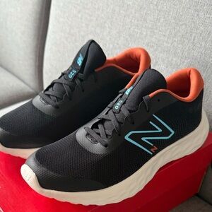 New Balance Kids Black Sneakers with Blue and Orange Accents